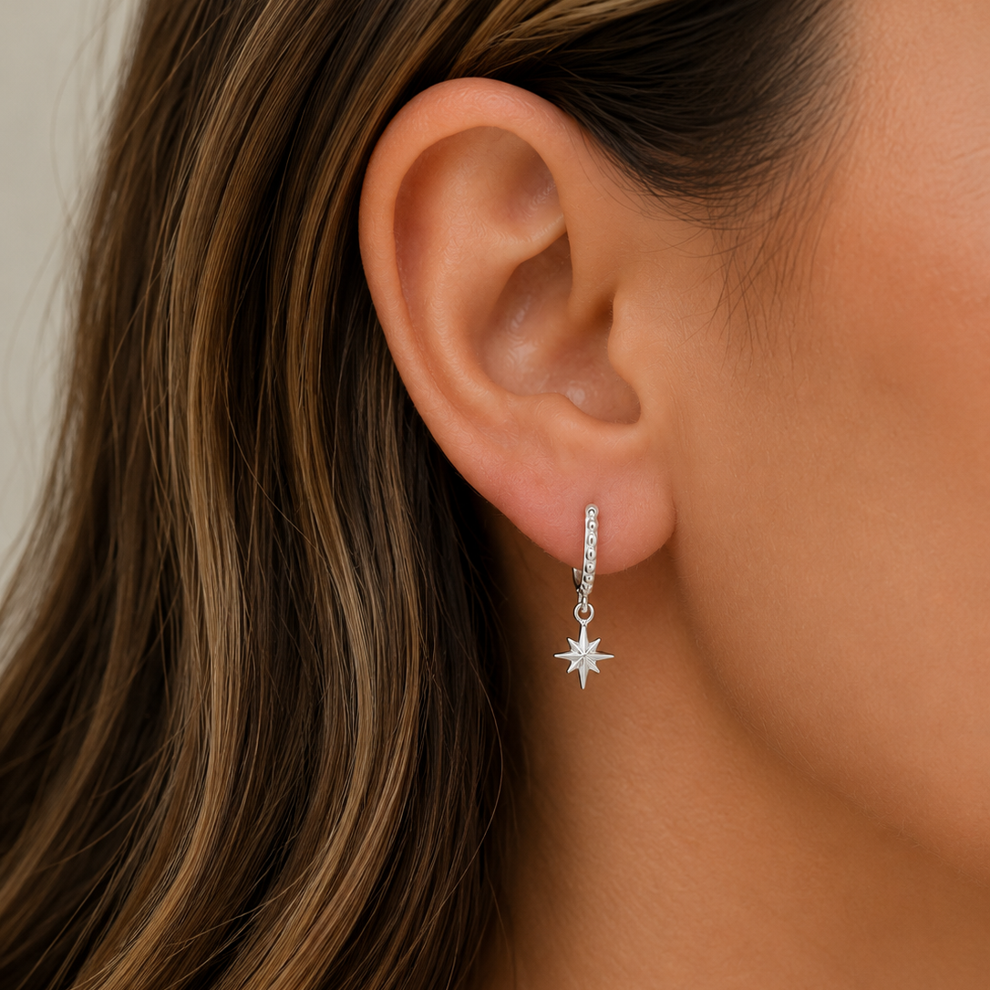 925 sterling silver North Star huggie earrings with dangling star charms