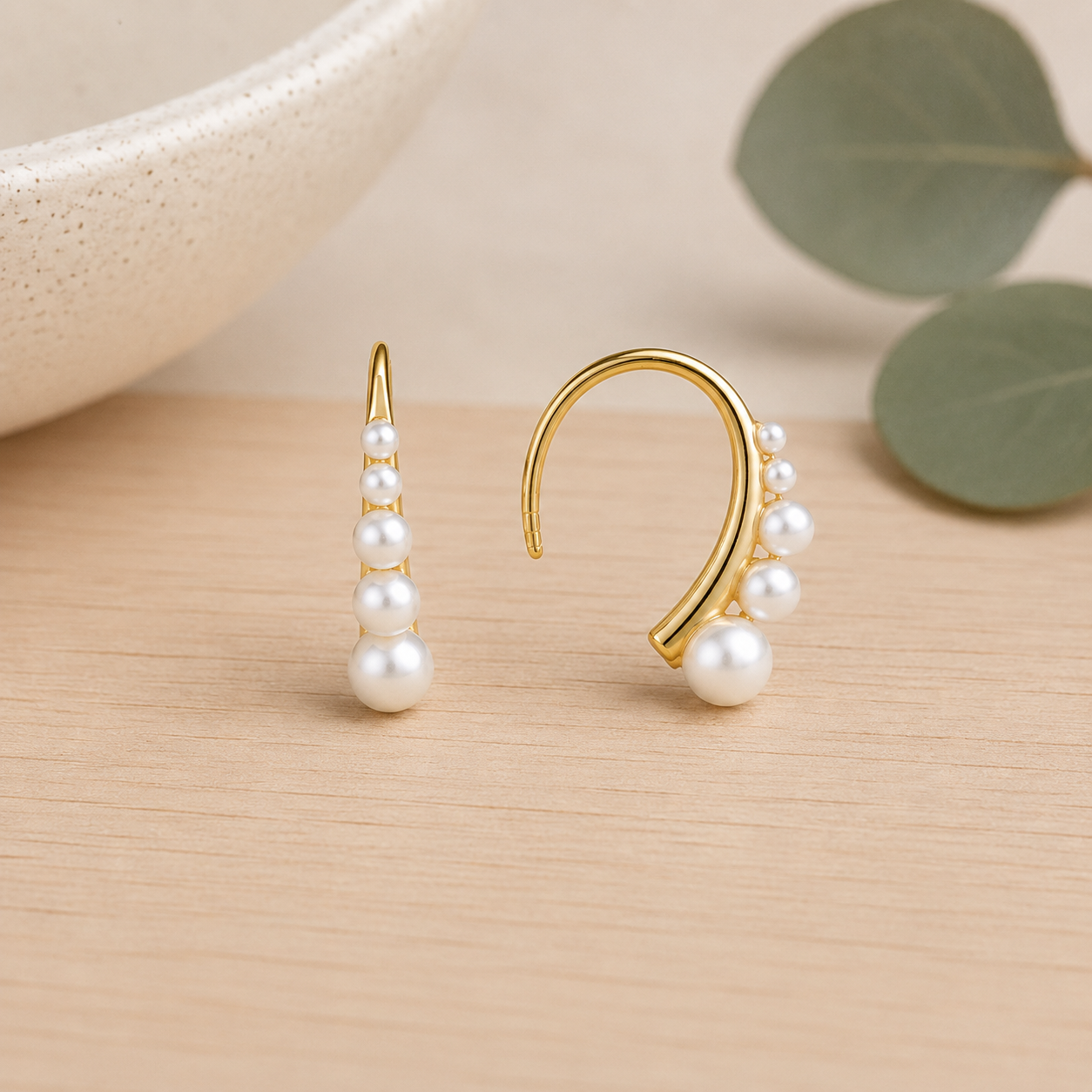 gold-plated-pearl-climber-earrings-on-ear.jpg
