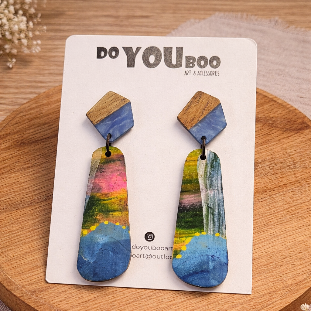 handmade abstract statement earrings with wood and painted design on neutral background