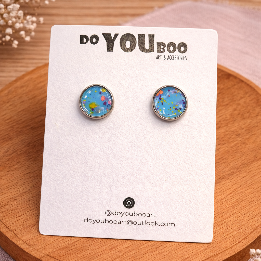 handmade blue speckled stud earrings with colourful paint detail