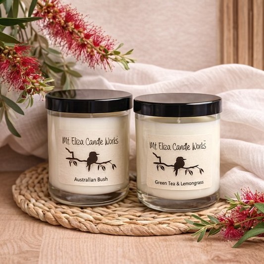 mt eliza candle works soy candles on light oak surface with soft neutral styling