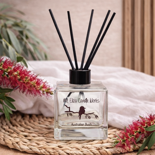 mt eliza candle works reed diffuser with bottlebrush flowers on light oak surface