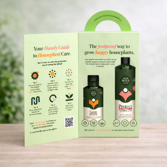 We The Wild plant care kit open box showing grow concentrate and protect spray with houseplant care guide